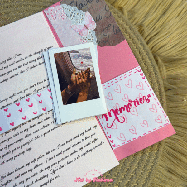 Close-up of Pink Pookie theme flap card with Polaroids and letter details