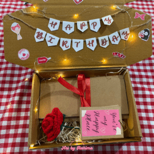 Decorated hamper with trifold card, polaroids ring album, and crochet rose with lights