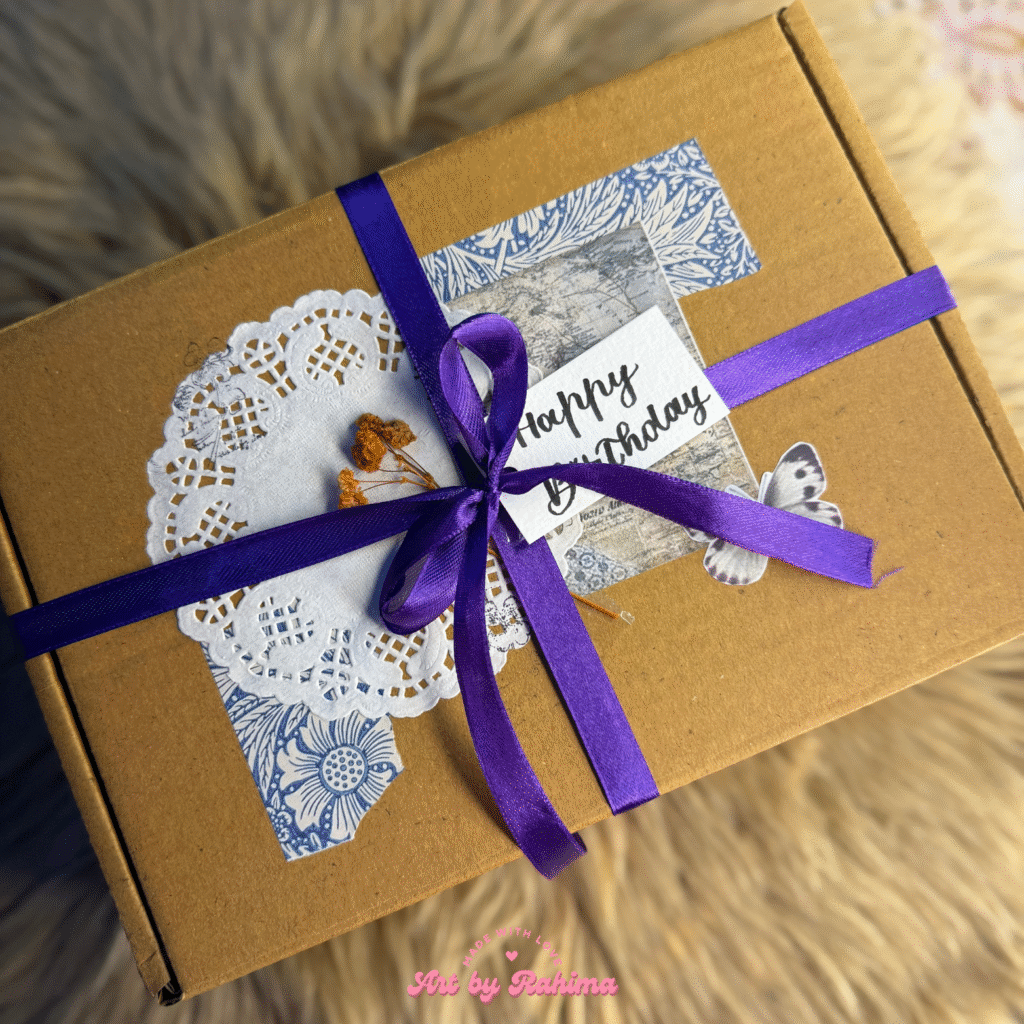 Aesthetic vintage style hamper with trifold card, bouquet, embroidered heart, and polaroids album