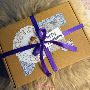 Aesthetic vintage style hamper with trifold card, bouquet, embroidered heart, and polaroids album