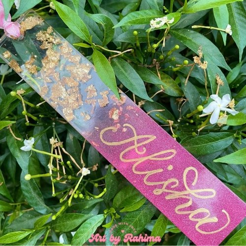 Handmade resin bookmark with flowers and glitter